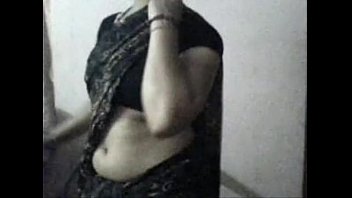 Seductive Housewife Seema Teases With A Steamy Strip Show